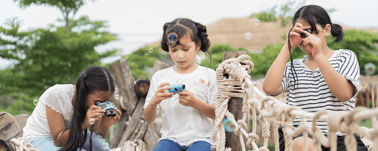 A group of students playing with bubbles